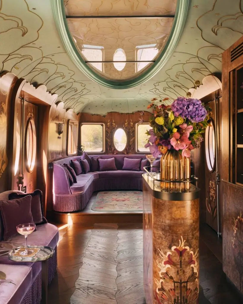 Curved sofa and flowers in a British Pullman carriage