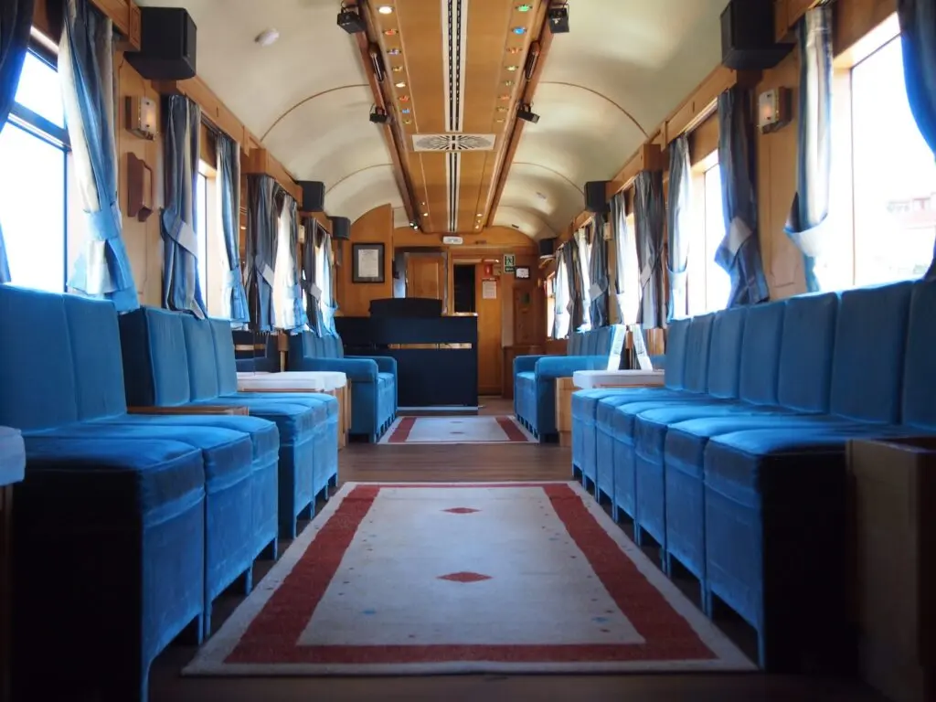 Blue velvet lounge car on the Costa Verde Express