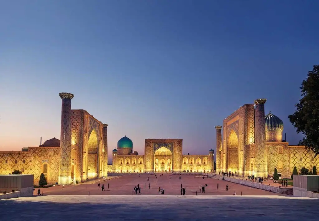 The three madrasahs of the Registan in Samarkand lit up at dusk