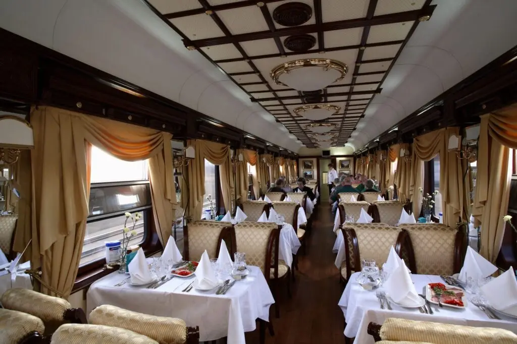 Dining car with gold curtains on the Golden Eagle